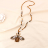 Collier long pendentif maxi abeille métal doré et perles cristal facettées 0123141 marron