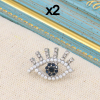 Pin's x2 oeil protecteur métal strass perles blanches acrylique 0623514 argenté