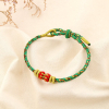 Bracelet ethnique tressé coulissant polyester 0225586 vert